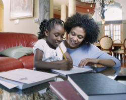  A parent helps a child with homework. 