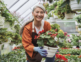  A woman holding a flowerpot